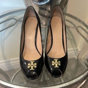 Tory Burch wedges. Has a little dent on the left heel. Not visible when worn.
